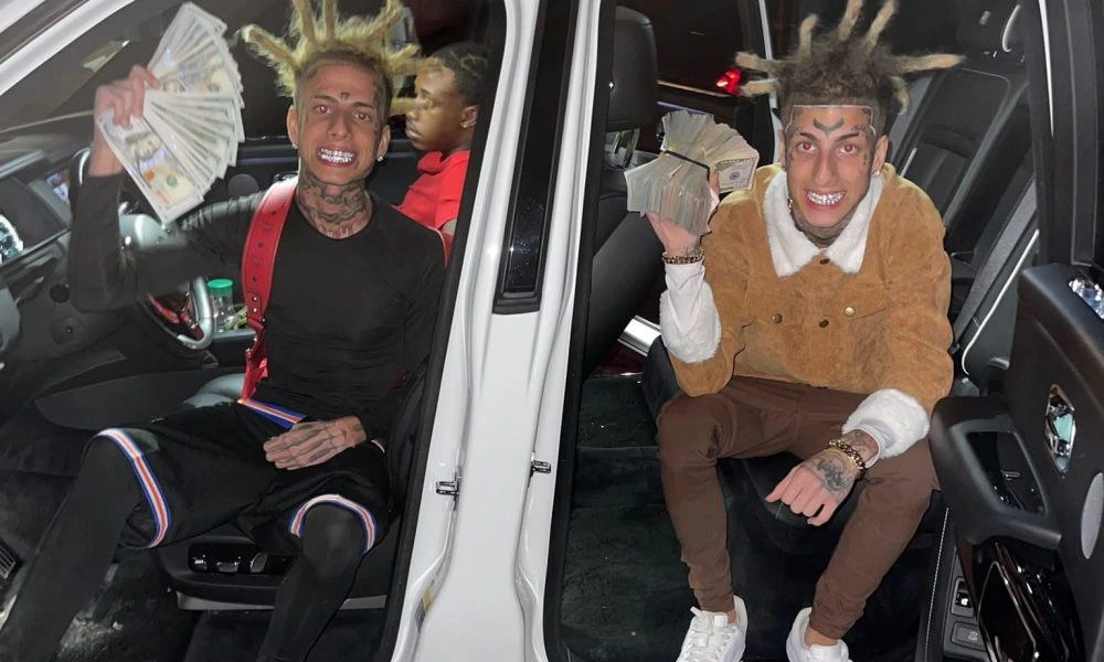 Franky Venegas (Kodiyakredd) sitting in a car holding a fan of cash