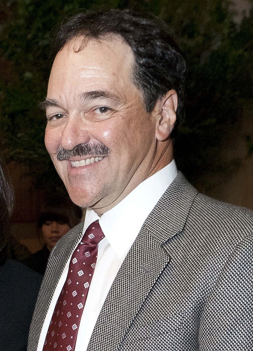 Frank P. Quattrone smiling in a suit and tie
