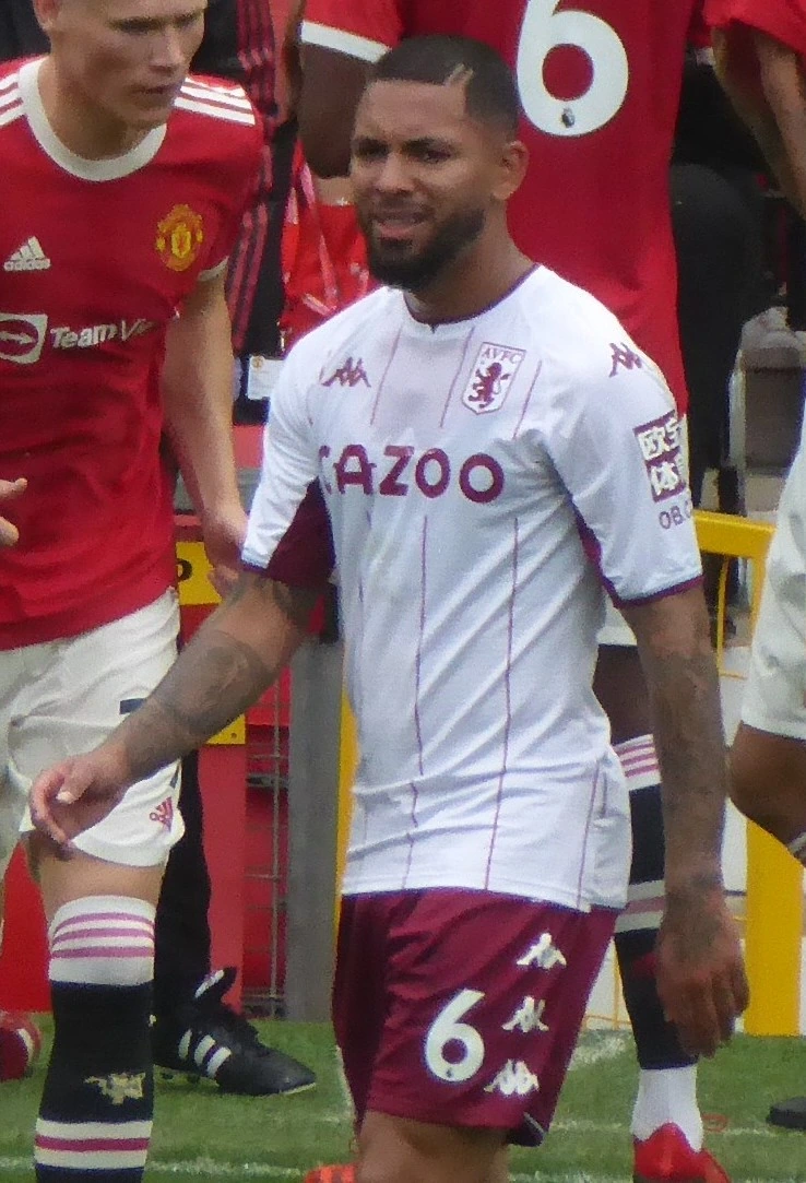 Douglas Luiz in an Aston Villa kit on the pitch