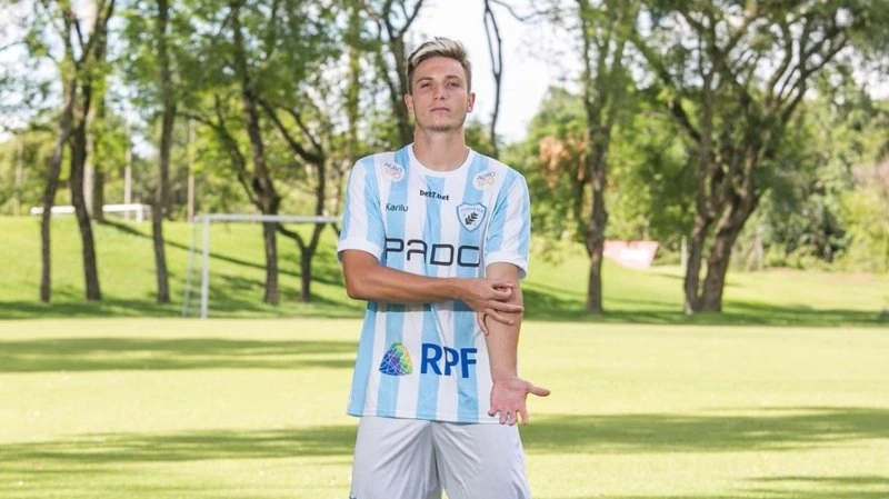 Juninho Manella posing in a soccer kit outdoors on a field