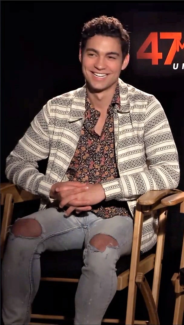Davi Santos smiling while seated in an interview setting