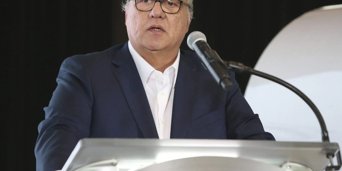 Lourenco Goncalves speaking at a podium during a public event