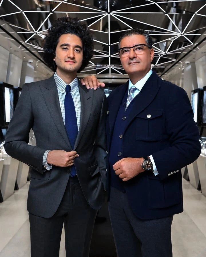 Yakov Arabov standing with another man in a luxury interior