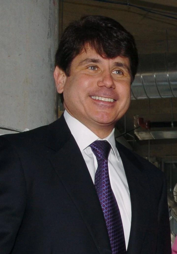 Rod R. Blagojevich smiling in a suit and tie