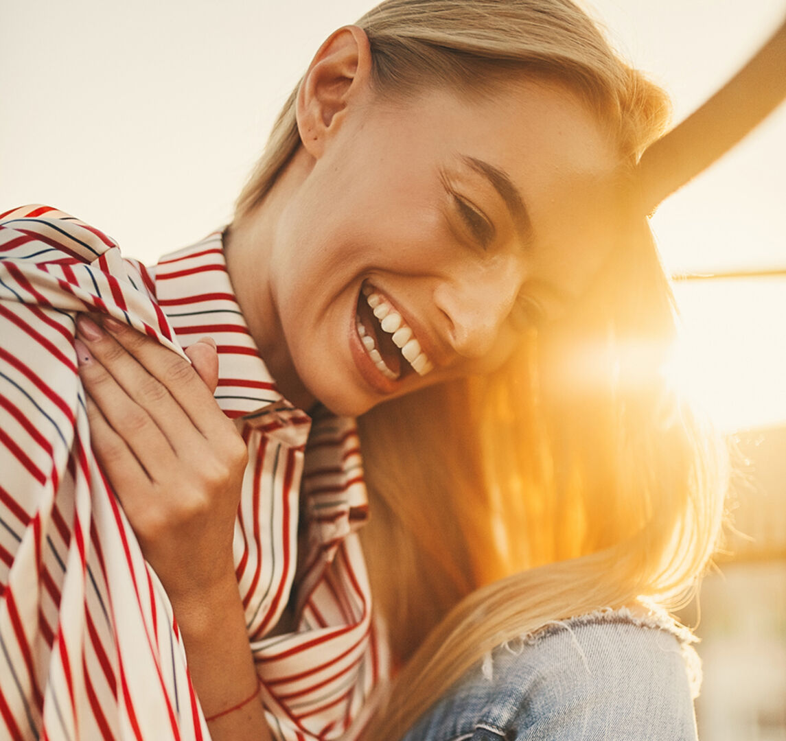 Glückliche junge Frau | Credit: iStock.com/Stanislav Hubkin