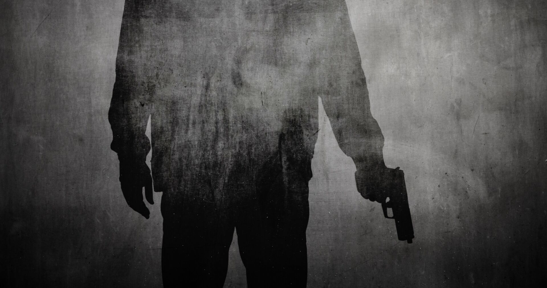 Schatten einer Person mit Pistole | Credit: iStock.com/ofc pictures
