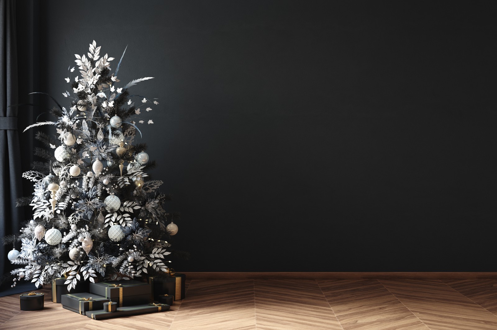 Ein schwarz-weißer Weihnachtsbaum steht vor einem schwarzen Hintergrund | Credit: iStock.com/Artjafara