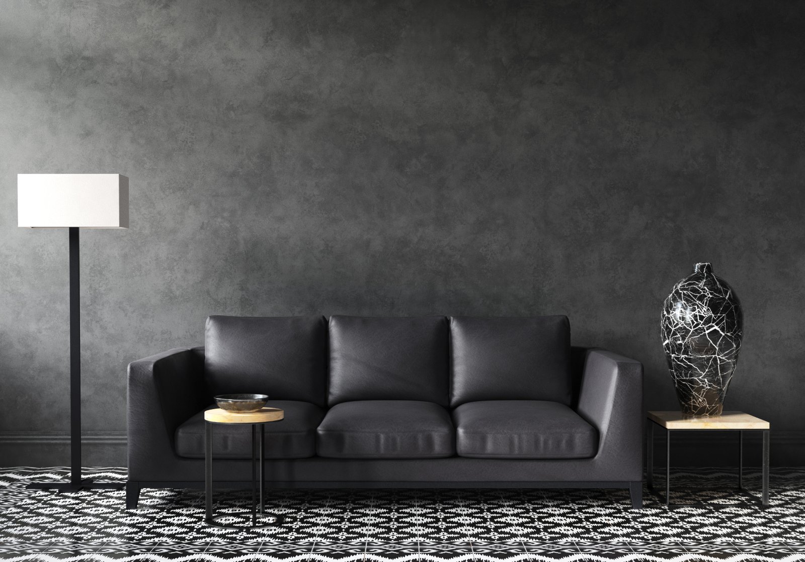 Eine schwarze Couch steht vor einer schwarzen Wand | Credit: iStock.com/Artjafara