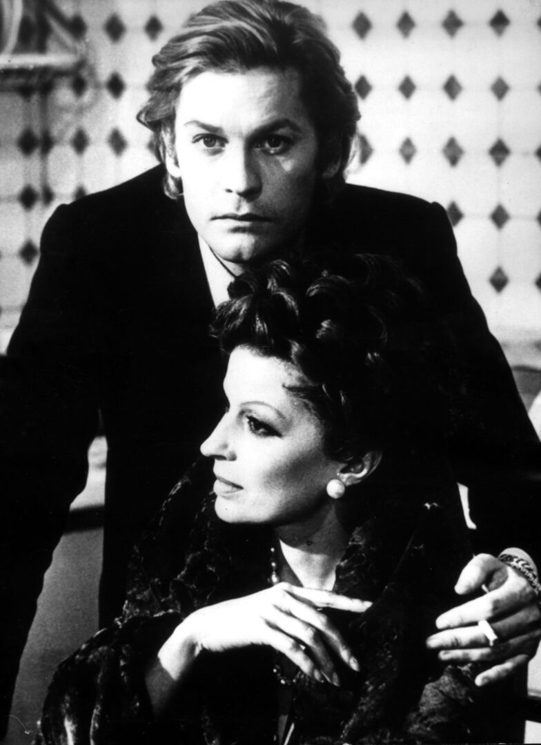 1975: Helmut Berger mit Silvana Mangano.