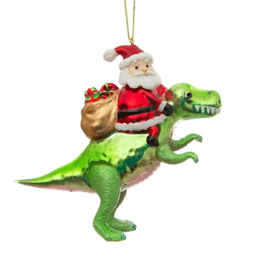Christbaumkugel: Santa sitzt auf einem Dinosaurier.