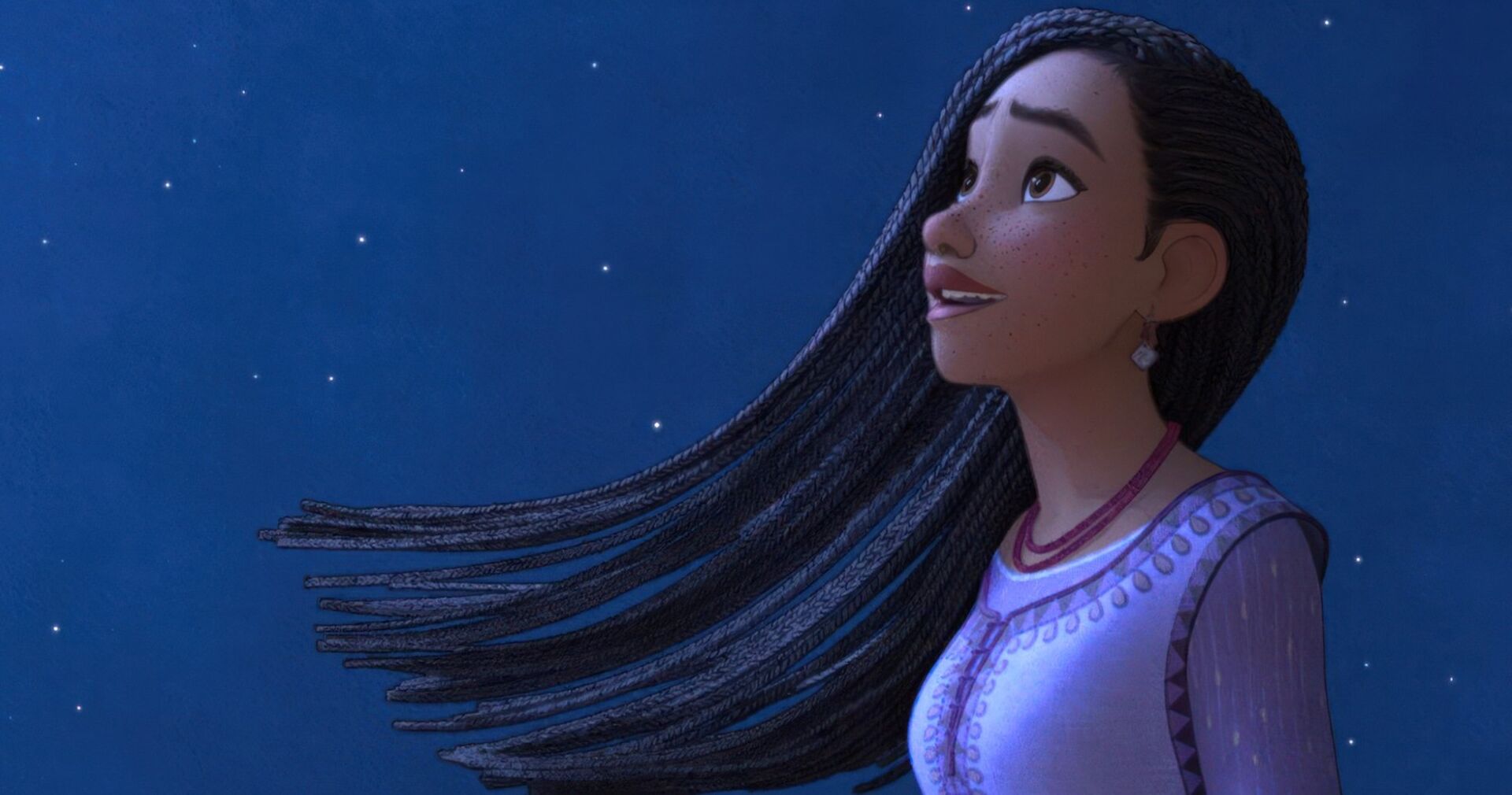 &quot;WISH&quot; ist ein Kinderfilm der eine animierte Person zeigt mit langen schwarzen Haaren, die in den Himmel blickt.