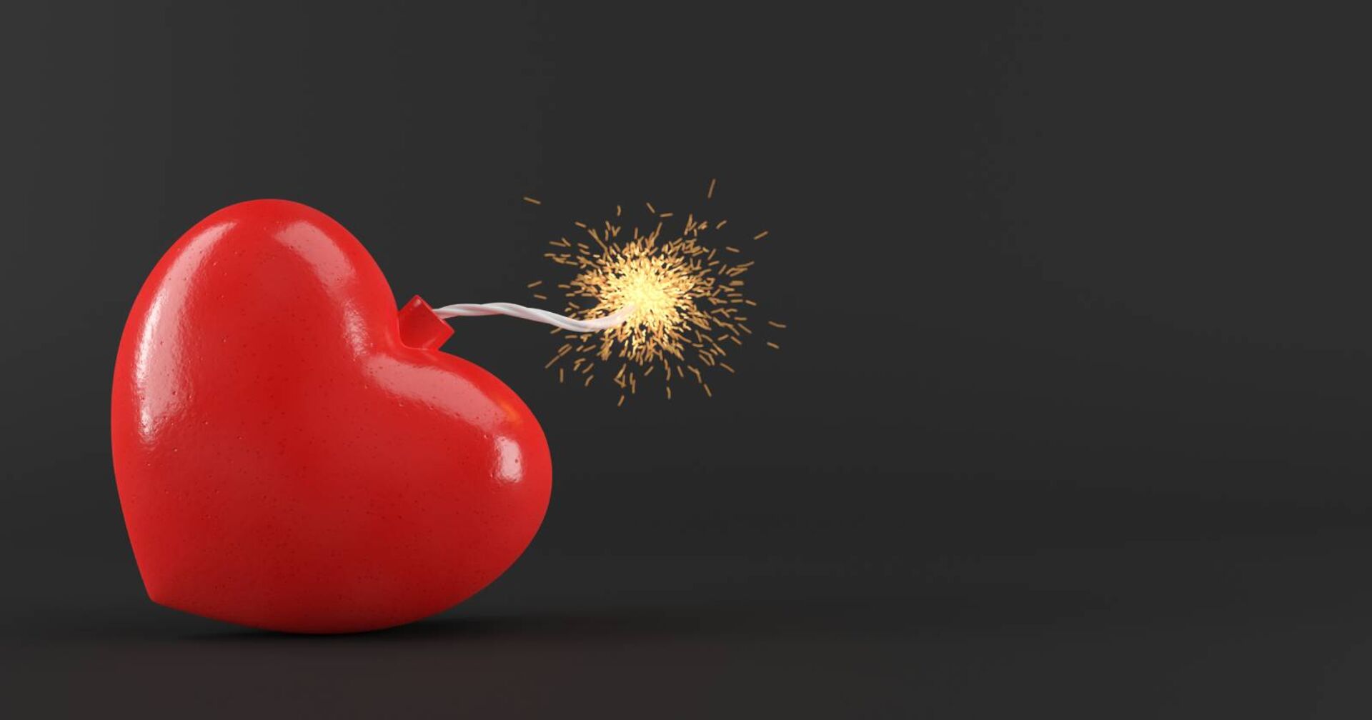 Darstellung einer herzförmigen Bombe mit gezündeter Zündschnur.