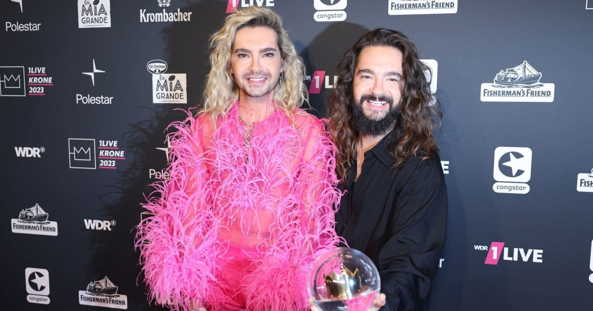 Bill und Tom Kaulitz auf einer Veranstaltung.