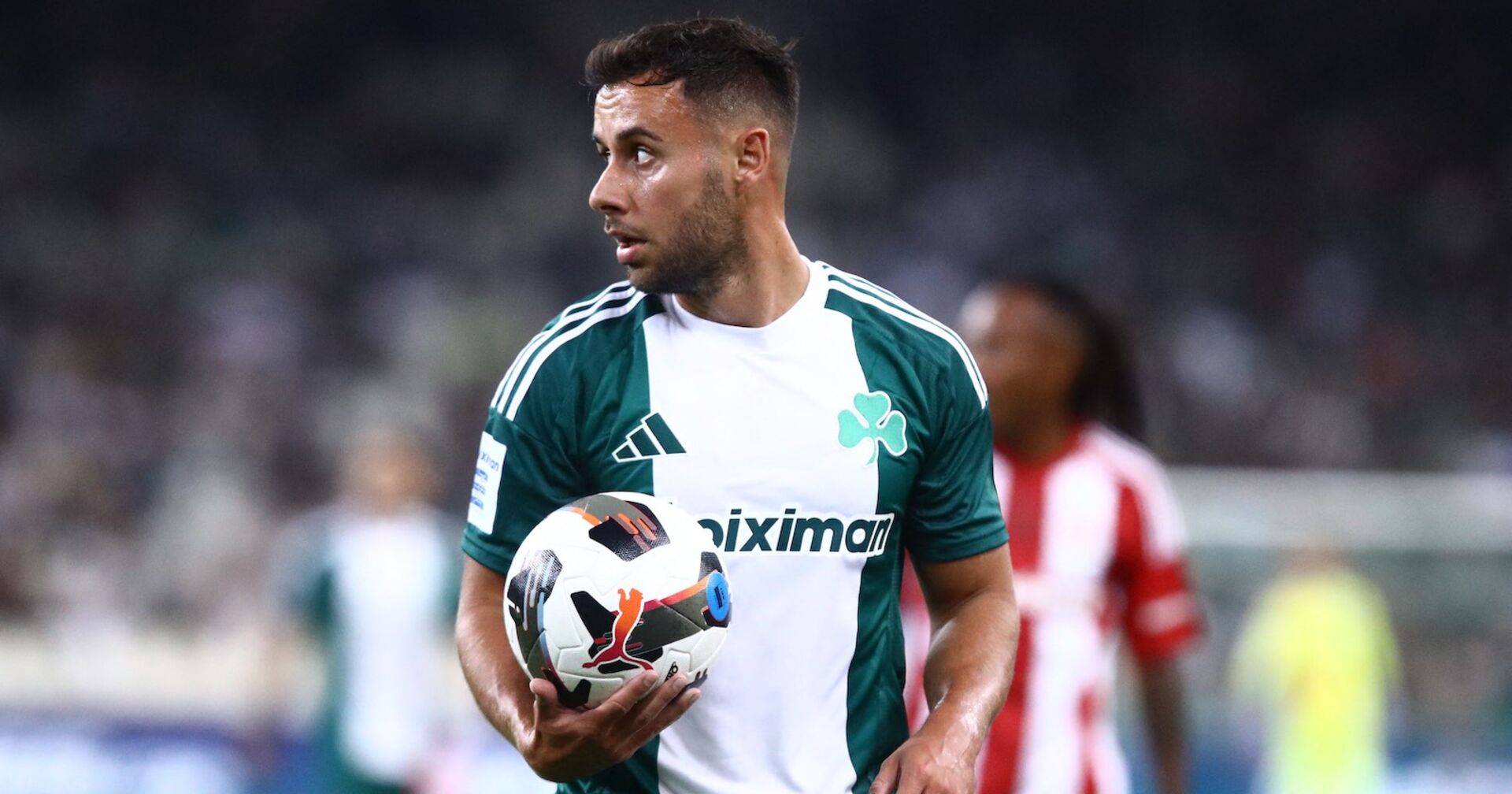 George Baldock mit einem Fußball in der Hand.