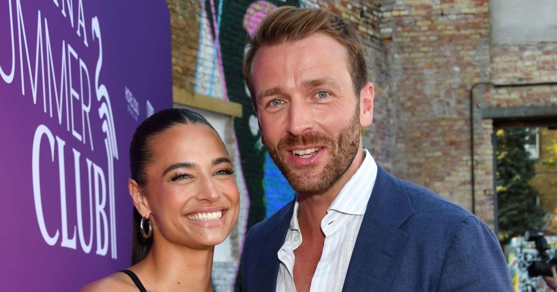 Amira Aly und  Christian Düren lächeln