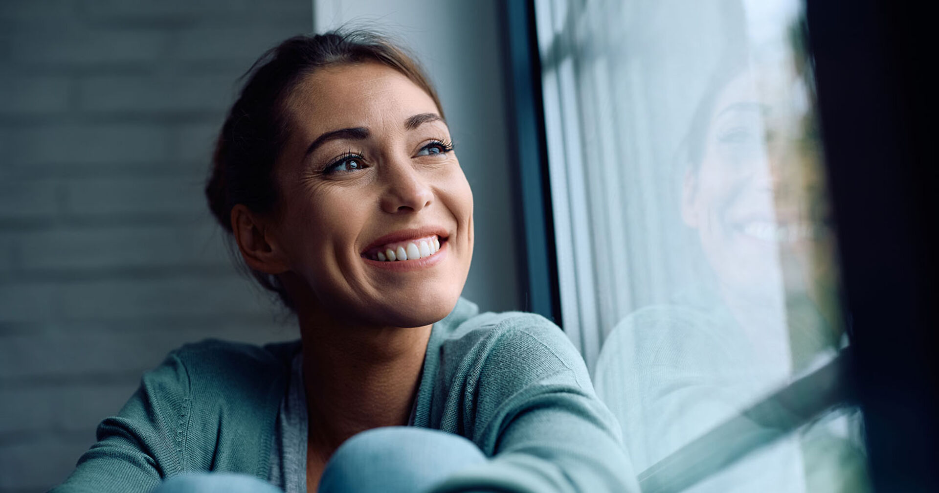 Frau lächelt | Credit: iStock.com/Drazen Zigic