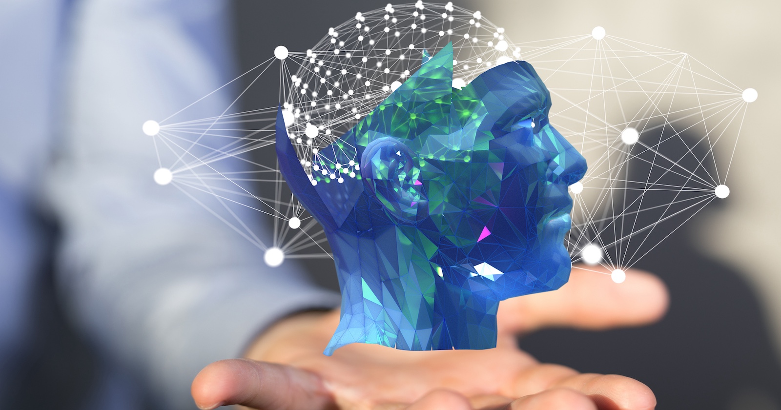 digitale Illustration eines in blau gehaltenen Kopfes auf einer menschlichen Hand