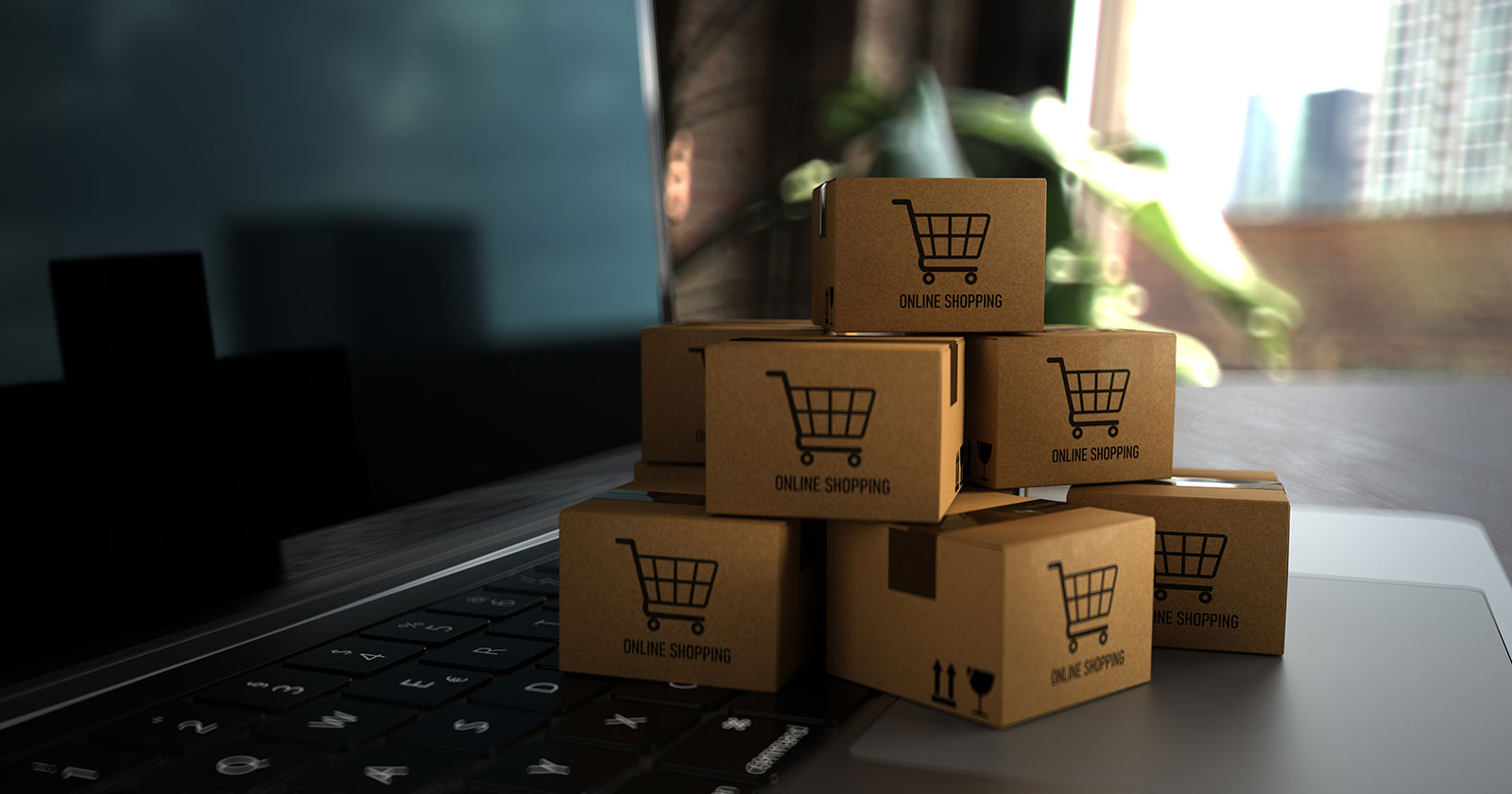 Mini-Pakete vor dem Notebook | Credit: iStock.com/style-photography