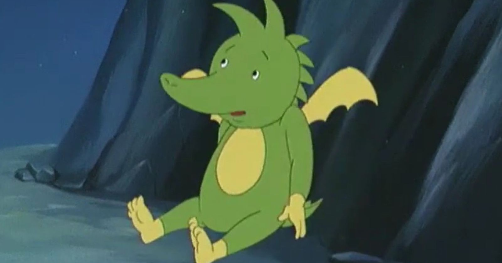 Drache sitzt in Höhle auf Boden