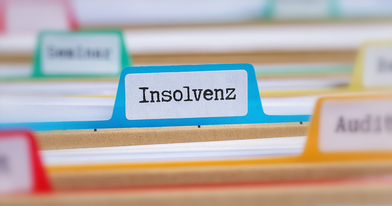 Bunte Registerkarten mit der Aufschrift "Insolvenz"