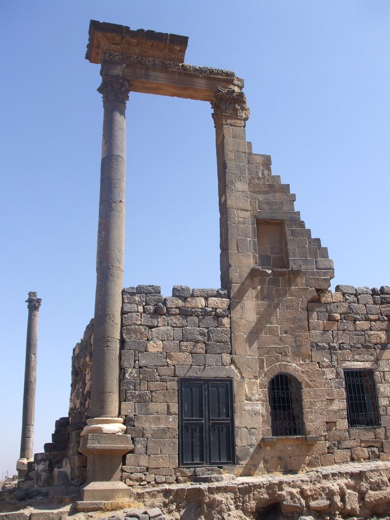 A house built under and among Roman ruins in Bosra, 2009
