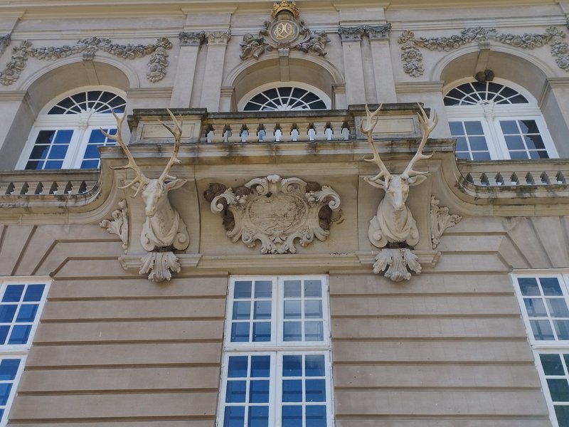 Carved stag heads supporting a balcony at Erimitageslottet