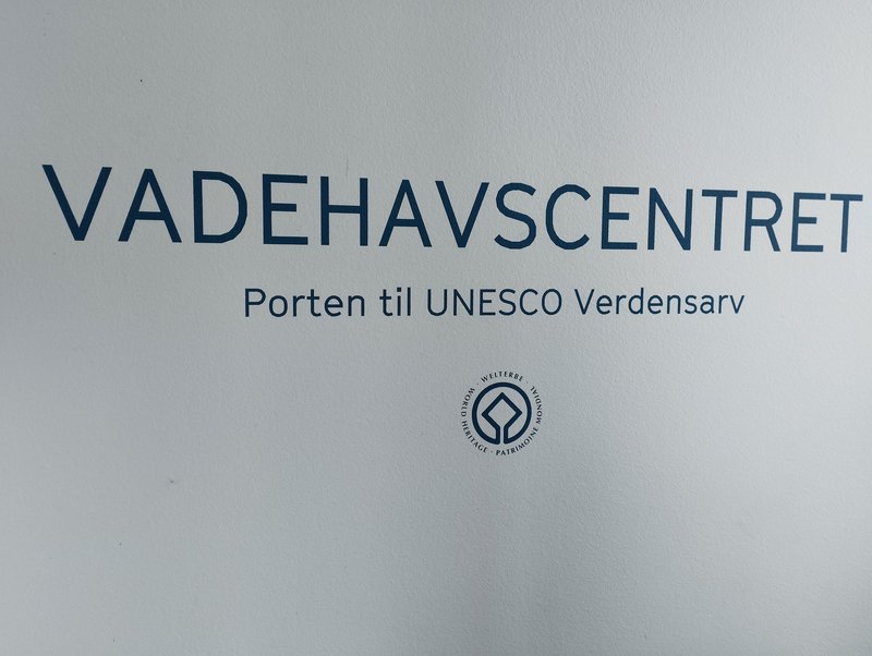 Sign with WHS logo in lobby of the Danish Wadden Sea Centre