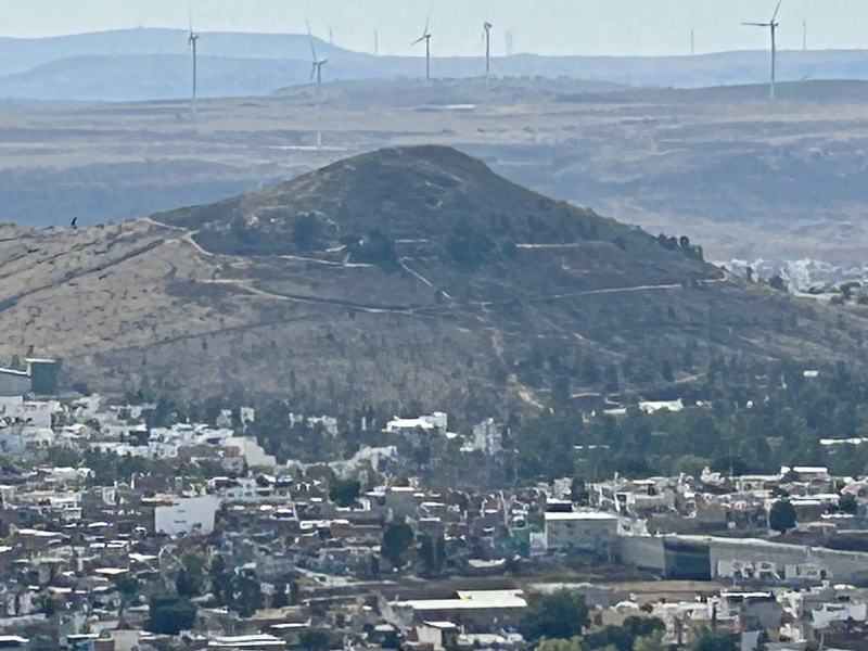 Both the hill where the photo was taken and the hill pictured are Wixarika Route sites in the city of Zacatecas.