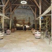 Wine barrels in a barn in Beaune