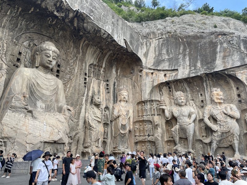 Immense relief carvings of Buddha, kings, boddhisatvas, and their guardians